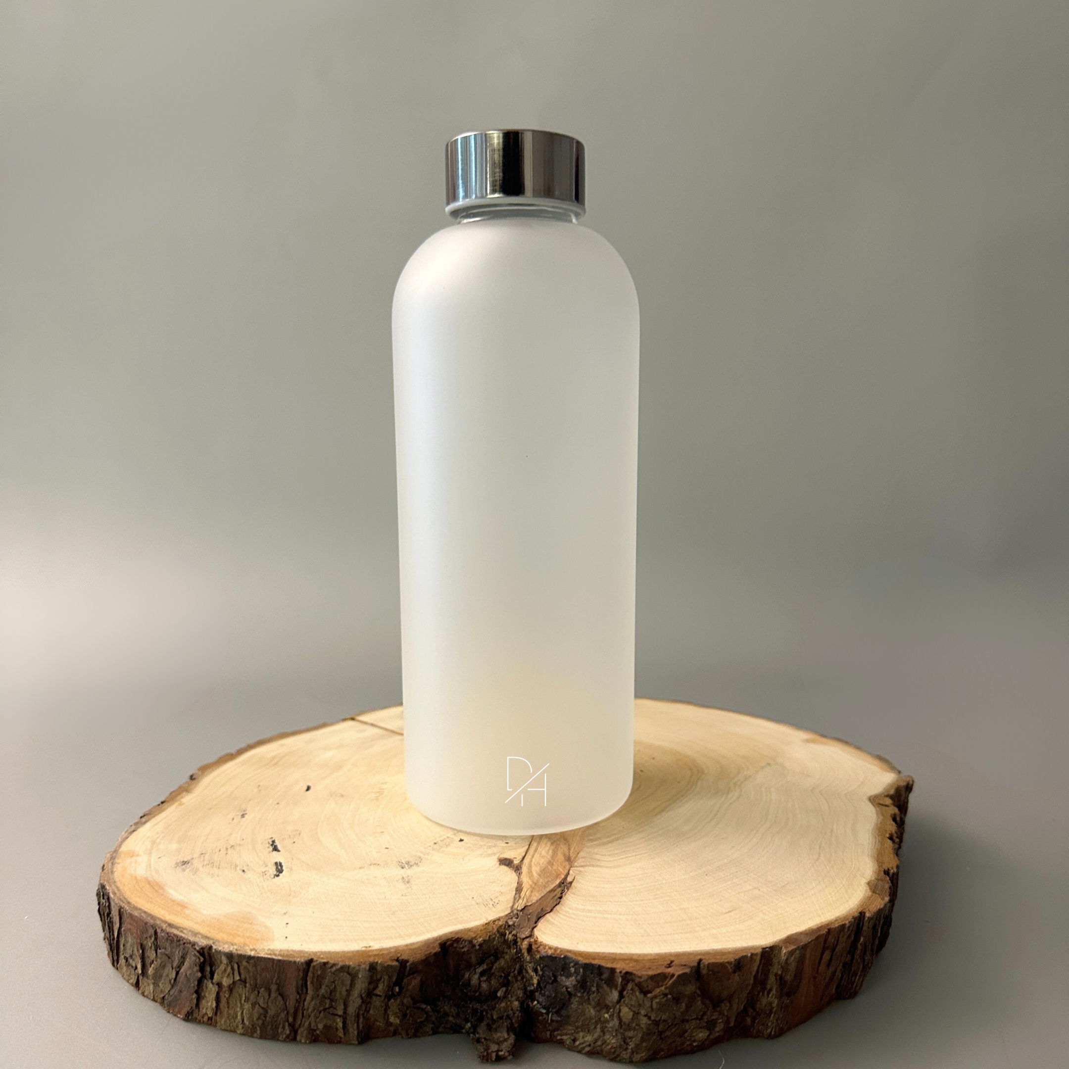 Reusable glass water bottle with frosted exterior - sustainable hydration solution