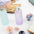 Frosty glass water bottle with wide mouth opening for easy cleaning and ice cubes