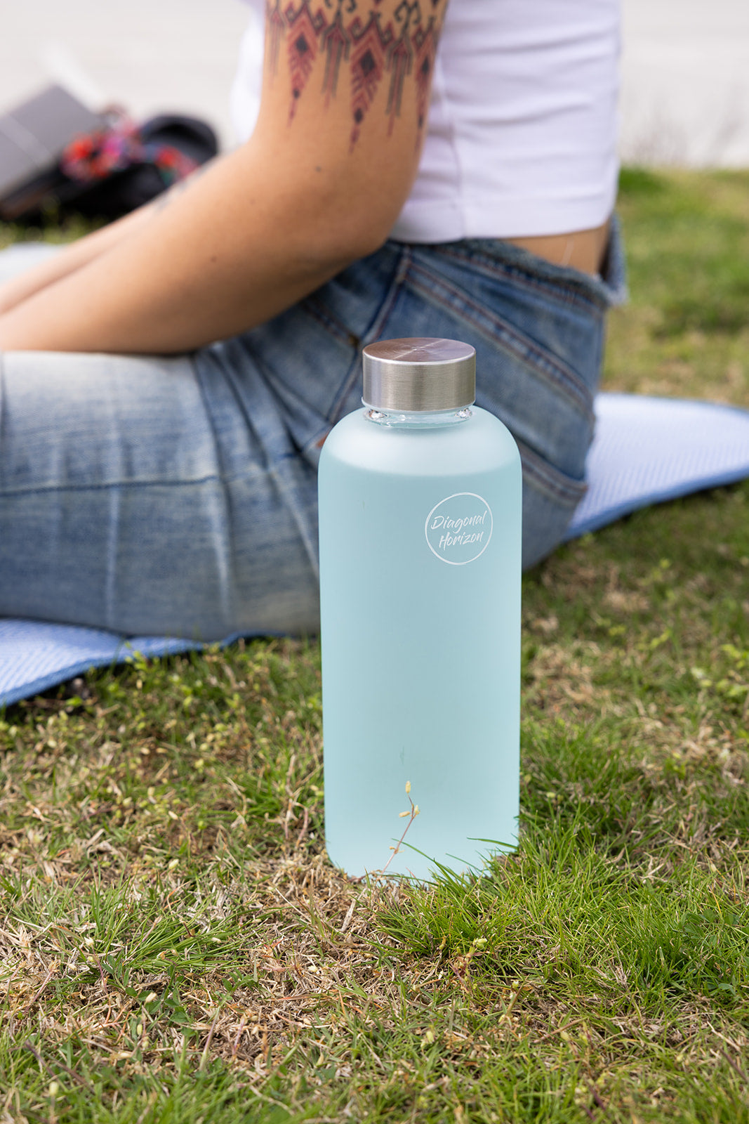 mint frosted glass water bottle with silver metal lid