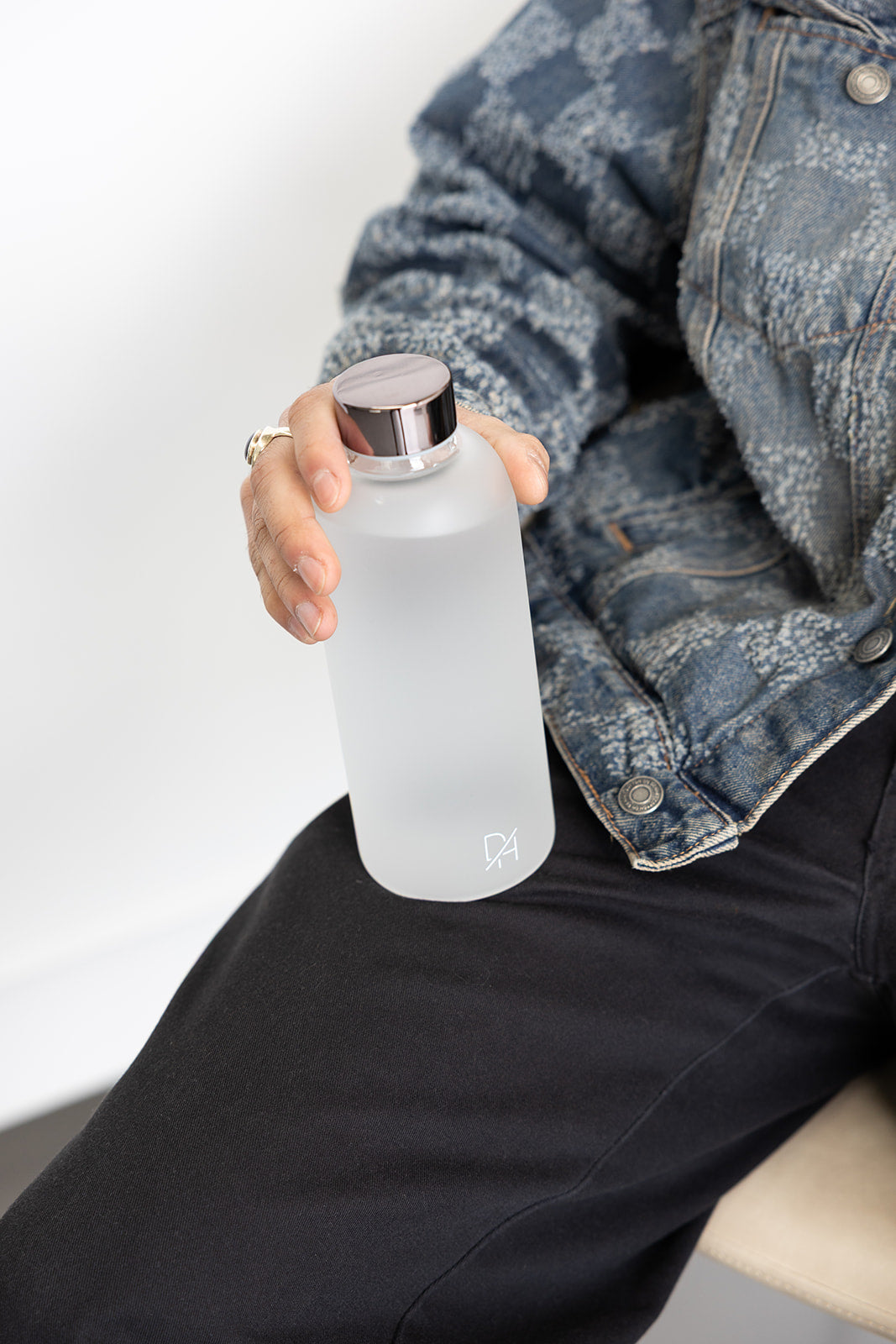 white frosted glass water bottle with gunmetal metal lid